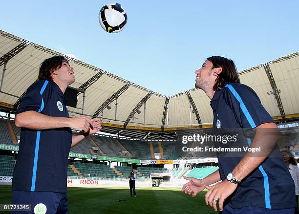 Rodrigo Alvim and Cristian Zaccardo in action during the VFL Wolfsburg training session at the Volkswagen Arena on June 26, 2008 in Wolfsburg,...