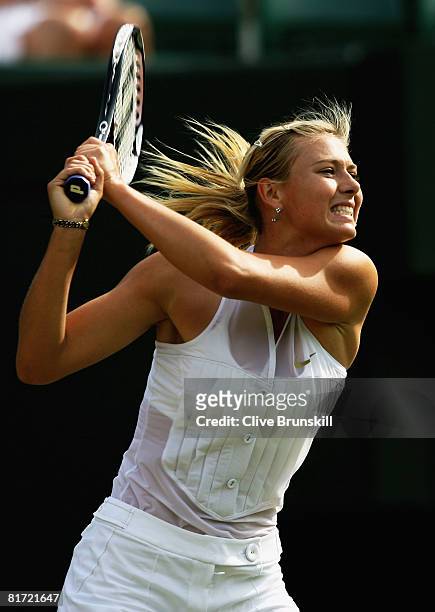 Maria Sharapova of Russia plays a forehand during the round two women's singles match against Alla Kudryavtseva of Russia on day four of the...