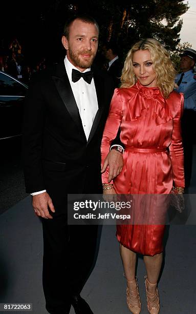 Singer Madonna and director Guy Richie arrives at amfAR's Cinema Against AIDS 2008 benefit held at Le Moulin de Mougins during the 61st International...