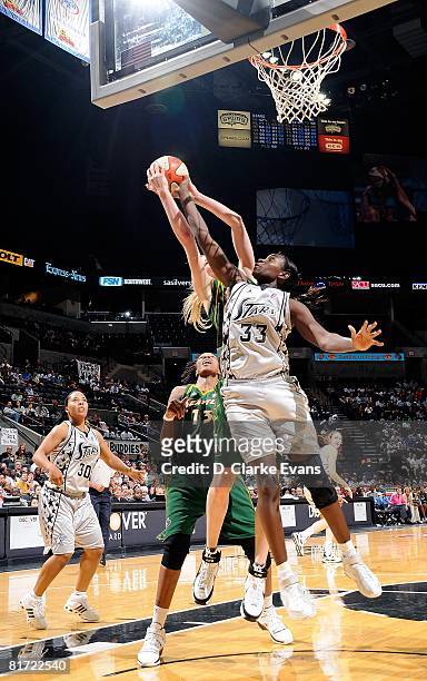 Sophia Young of the San Antonio Silver Stars challenges the shot by Lauren Jackson of the Seattle Storm during the WNBA game on June 13, 2008 at the...