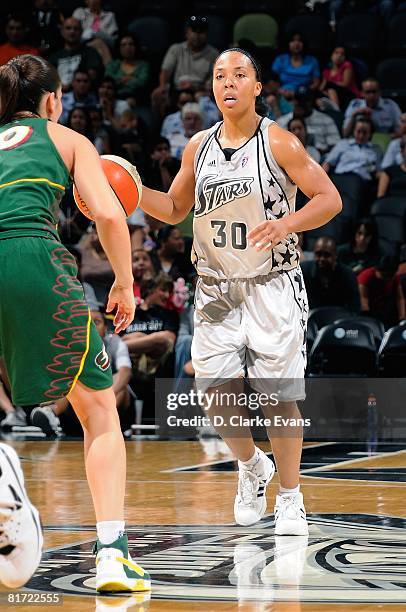 Helen Darling of the San Antonio Silver Stars surveys the floor against Sue Bird of the Seattle Storm during the WNBA game on June 13, 2008 at the...