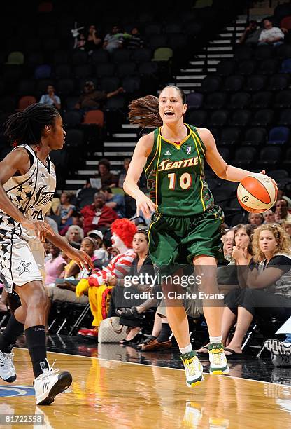 Sue Bird of the Seattle Storm surveys the floor against Morenike Atunrase of the San Antonio Silver Stars during the WNBA game on June 13, 2008 at...