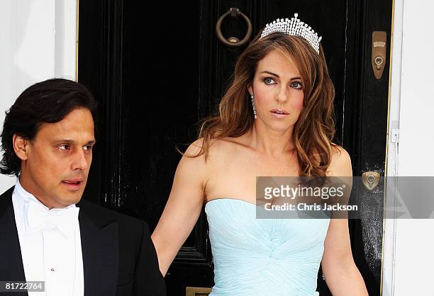 Actress Liz Hurley and her husband Arun Nayar leave their home for Elton John's White tie and Tiara Ball on June 26, 2008 in London, England.