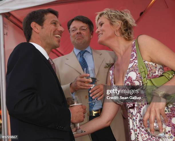 Deutsche Telekom head Rene Obermann, Peter Schwenkow and television presenter Carola Ferstl attend the Bild Summer Party on June 26, 2008 in Berlin,...