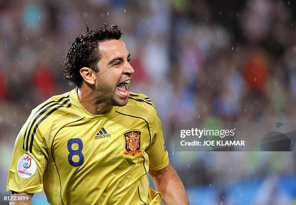 Spanish midfielder Xavi Hernandez celebrates after scoring the opening goal during the Euro 2008 championships semi-final football match Russia vs....