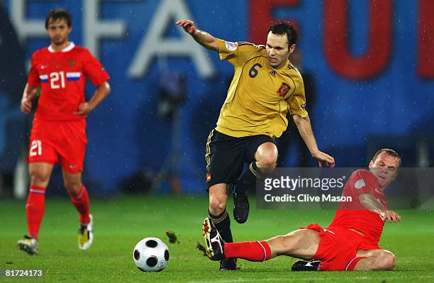 Aleksandr Anyukov of Russia tackels Spain's Andres Iniesta during the UEFA EURO 2008 Semi Final match between Russia and Spain at Ernst Happel...