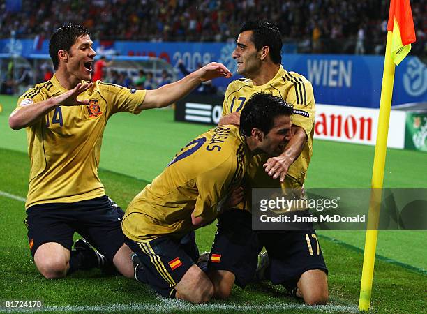 Daniel Guiza of Spain celebrates scoring Spain's second goal with Xabi Alonso and Cesc Fabregas of Spain during the UEFA EURO 2008 Semi Final match...