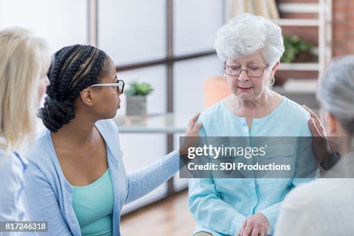 Senior woman gets small group support at senior meeting