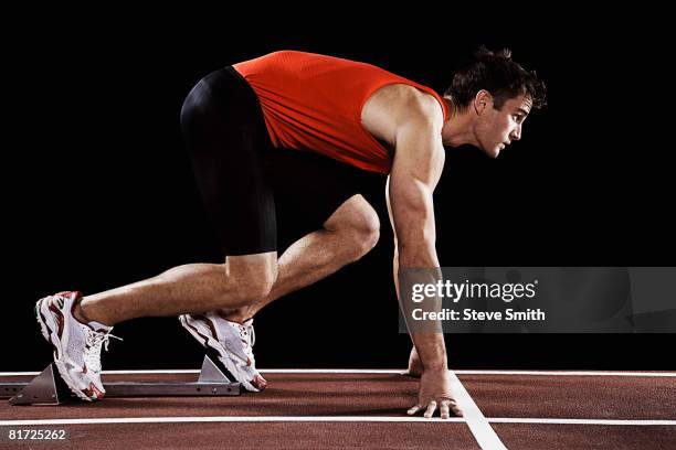 runner on race track at his mark - starting block stock pictures, royalty-free photos & images