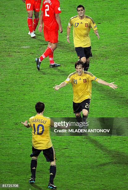 Spanish midfielder Cesc Fabregas, Spanish midfielder David Silva and Spanish forward Daniel Guiza celebrate at the end of the Euro 2008 championships...