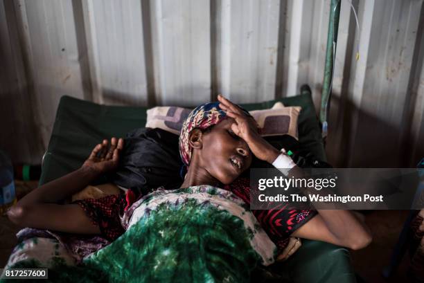 Woman suffers from symptoms related to acute watery diarrhea and cholera at the cholera treatment center of a regional hospital in Baidoa, Somalia on...