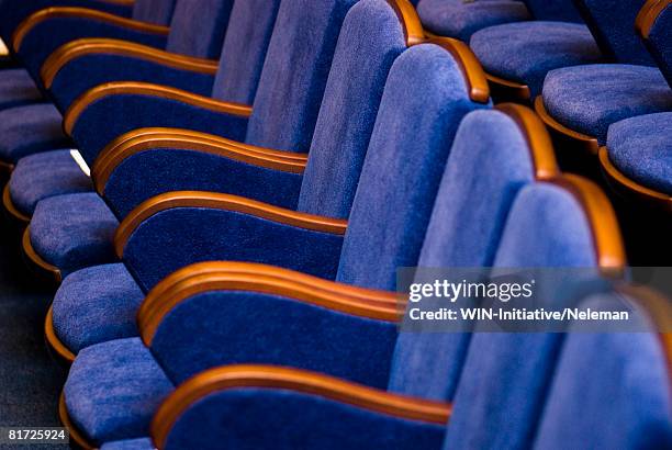 blue chairs, close-up - kinosaal stock-fotos und bilder