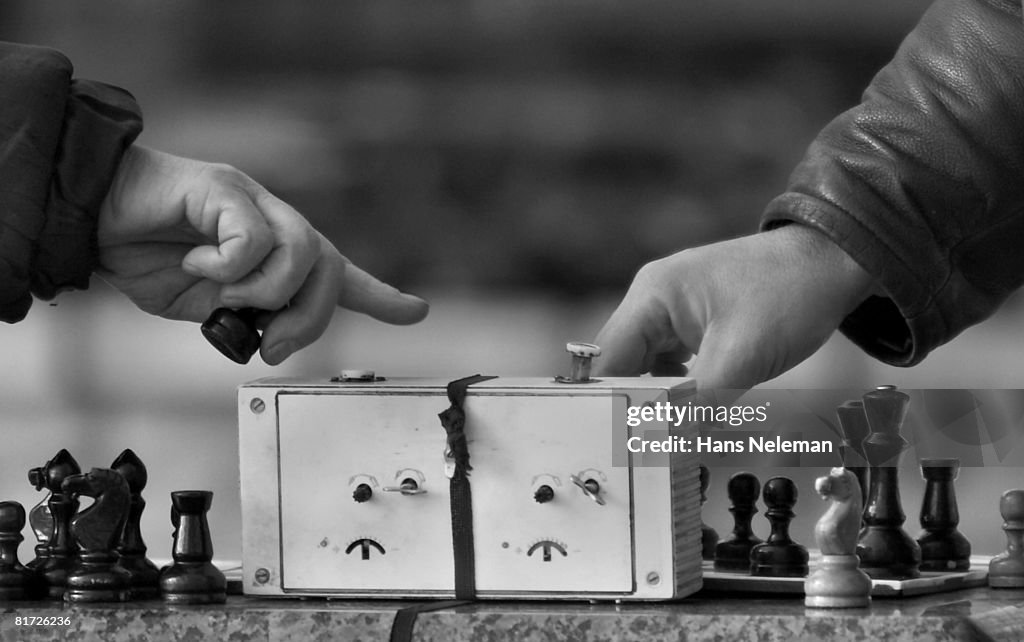 Two people playing chess (B&W)