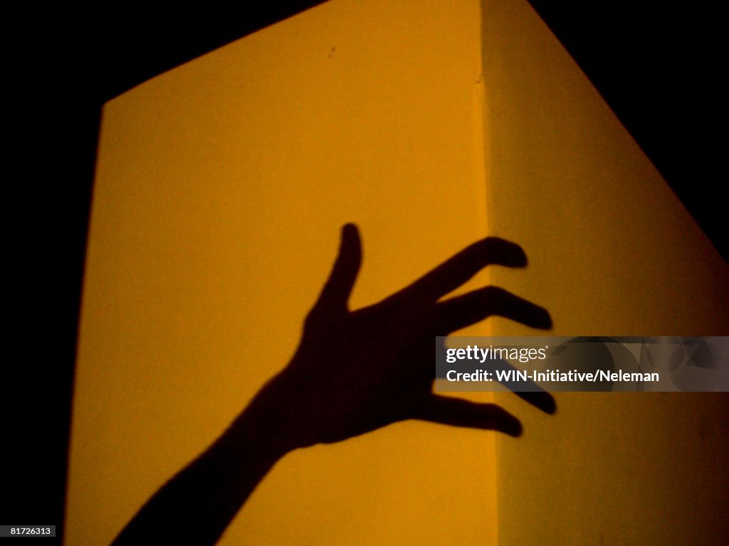 Hand shadow on cube