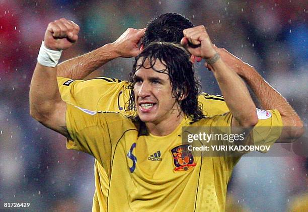 Spanish defender Carles Puyol celebrates after Spain won the Euro 2008 championships semi-final football match Russia vs. Spain on June 26, 2008 at...