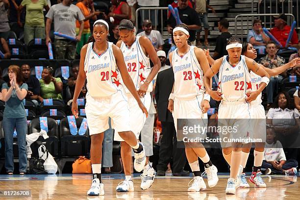 Camille Little, Stacey Lovelace, Tamera Young, Betty Lennox and Ivory Latta of the Atlanta Dream walk on the court during the WNBA game against the...