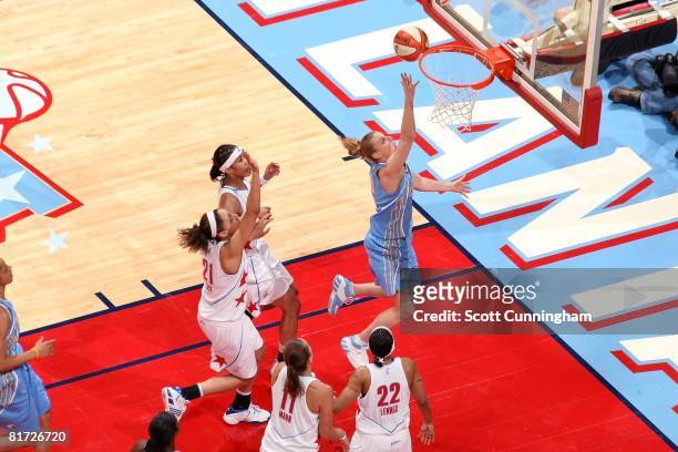 Cathy Joens of the Chicago Sky puts up a shot against Tamera Young, Jennifer Lacy, Kristen Mann and Betty Lennox of the Atlanta Dream during the WNBA...