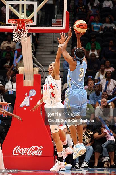 Tamera Young of the Atlanta Dream challenges the shot by Dominique Canty of the Chicago Sky during the WNBA game on June 6, 2008 at Philips Arena in...