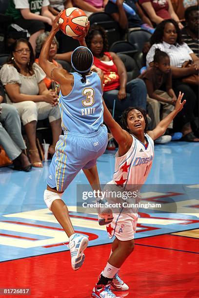 Ivory Latta of the Atlanta Dream challenges the shot by Dominique Canty of the Chicago Sky during the WNBA game on June 6, 2008 at Philips Arena in...