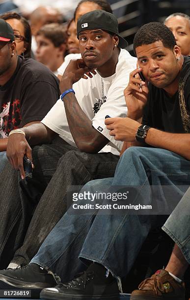 Marvin Williams of the Atlanta Hawks and Sean May of the Charlotte Bobcats watch the action between the Atlanta Dream and the Chicago Sky at Philips...