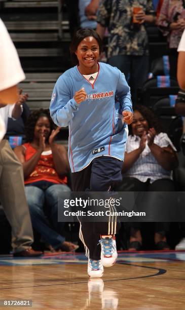 Ivory Latta of the Atlanta Dream runs onto the court during player introductions prior to the WNBA game against the Chicago Sky on June 6, 2008 at...