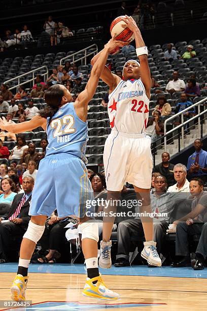 Betty Lennox of the Atlanta Dream takes a jump shot under pressure against Armintie Price of the Chicago Sky during the WNBA game on June 6, 2008 at...