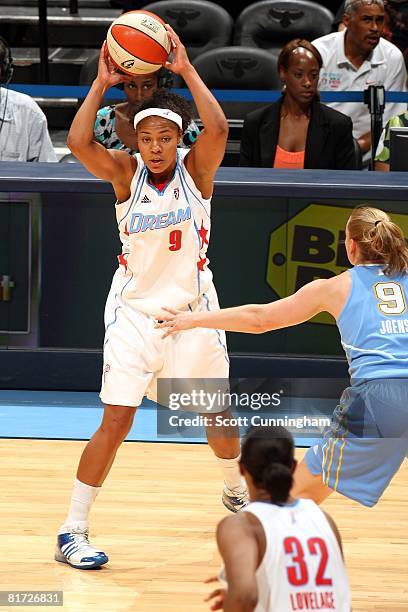 Chioma Nnamaka of the Atlanta Dream looks to pass the ball against Cathy Joens of the Chicago Sky during the WNBA game on June 6, 2008 at Philips...