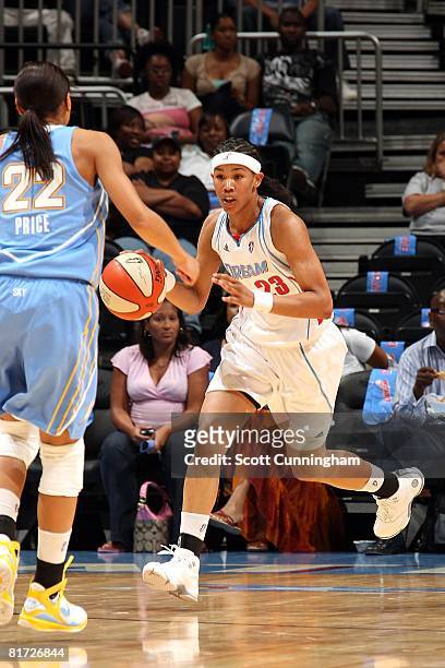 Tamera Young of the Atlanta Dream moves the ball upcourt against Armintie Price of the Chicago Sky during the WNBA game on June 6, 2008 at Philips...