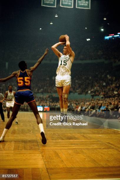 Tom Heinsohn of the Boston Celtics shoots a jump shot against the Golden State Warriors circa 1964 at the Boston Garden in Boston, Massachusetts....