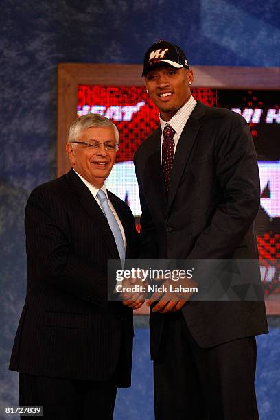 Commissioner David Stern shakes hands with number two draft pick for the Miami Heat, Michael Beasley during the 2008 NBA Draft at the Wamu Theatre at...