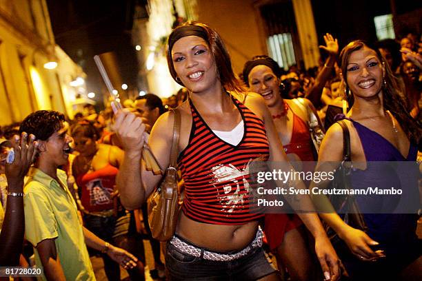 Cuban transvestites dance as conga groups march through the streets during the Camaguey carnival June 24, 2008 in Camaguey, Cuba. The first day...