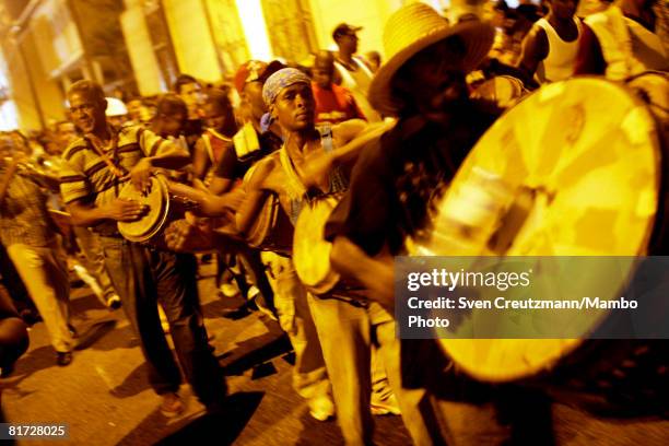 Cubans hit their drums as conga groups march through the streets during the Camaguey carnival June 24, 2008 in Camaguey, Cuba. The first day...