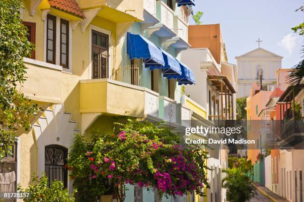 street scene in old san juan, puerto rico with the san juan cathedral in background. - velha san juan imagens e fotografias de stock