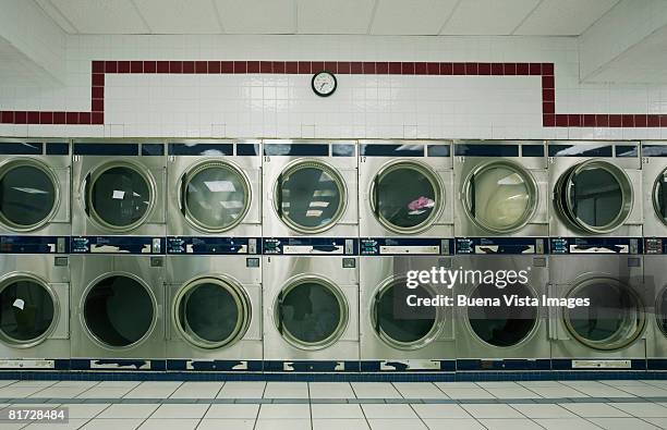 line of dryers in laundrymat - laundromat fotografías e imágenes de stock