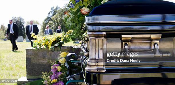 funeral procession in cemetery. - coffin photos et images de collection