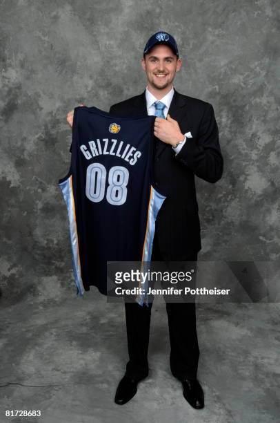 Kevin Love selected number five overall by the Memphis Grizzlies poses for a portrait backstage during the 2008 NBA Draft on June 26, 2008 at the...