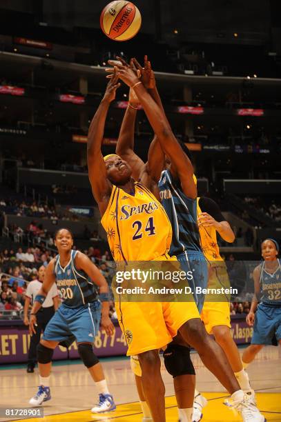 Marie Ferdinand-Harris of the Los Angeles Sparks attempts a rebound against Taj McWilliams-Franklin of the Washington Mystics on June 26, 2008 at...