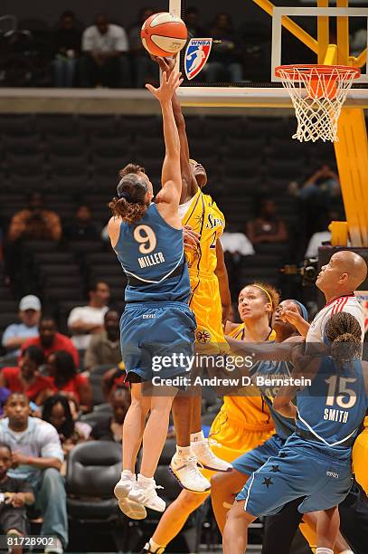 Marie Ferndinand-Harris of the Los Angeles Sparks blocks a shot from Coco Miller of the Washington Mystics on June 26, 2008 at Staples Center in Los...