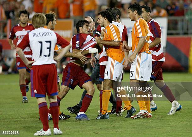 Dwayne De Rosario of the Houston Dynamo pulls up Marcelo Saragosa of FC Dallas by his shirt at Robertson Stadium June 26, 2008 in Houston, Texas.