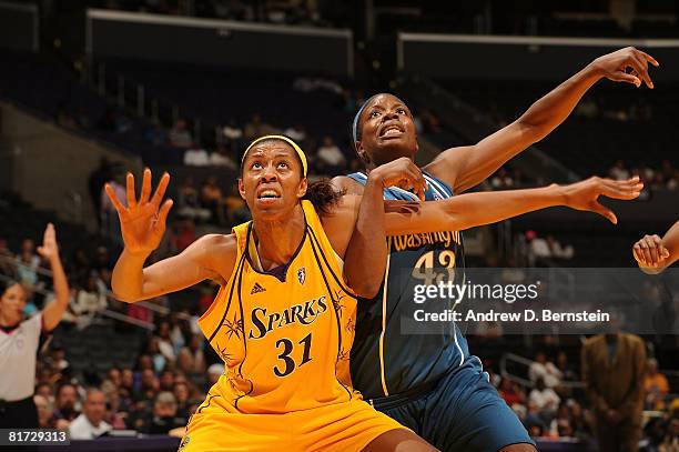 Jessica Moore of the Los Angeles Sparks guards against Nakia Sanford of the Washington Mystics on June 26, 2008 at Staples Center in Los Angeles,...