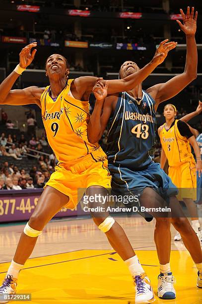 Lisa Leslie of the Los Angeles Sparks guards against Nakia Sanford of the Washington Mystics on June 26, 2008 at Staples Center in Los Angeles,...
