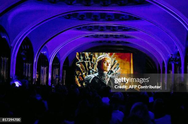 People watch the seventh season premiere of US TV show "Game of Thrones" at the Mayakovskaya metro station in Moscow early on July 18, 2017. "Game of...