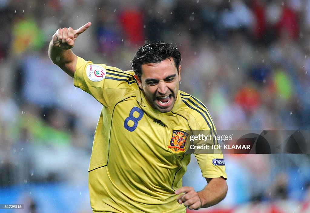 Spanish midfielder Xavi Hernandez celebr