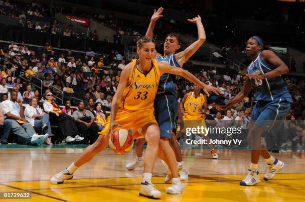 Raffaella Masciadri of the Los Angeles Sparks dribbles along the baseline against Coco Miller of the Washington Mystics during their game on June 26,...