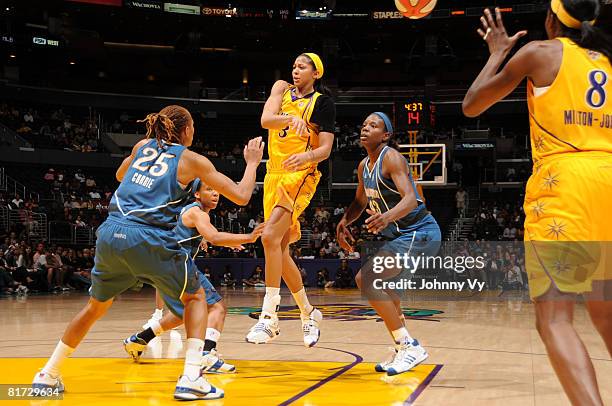 Candace Parker of the Los Angeles Sparks passes to teammate Delisha Milton-Jones during their game against of the Washington Mystics on June 26, 2008...