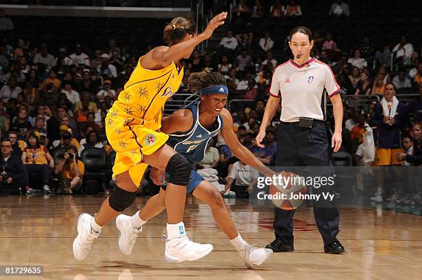 Crystal Smith of the Washington Mystics drives against Keisha Brown of the Los Angeles Sparks during their game on June 26, 2008 at Staples Center in...