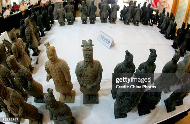 Replicas of terracotta warriors are displayed during a contest for improving the quality of warrior replica statues on June 27, 2008 in Lintong...