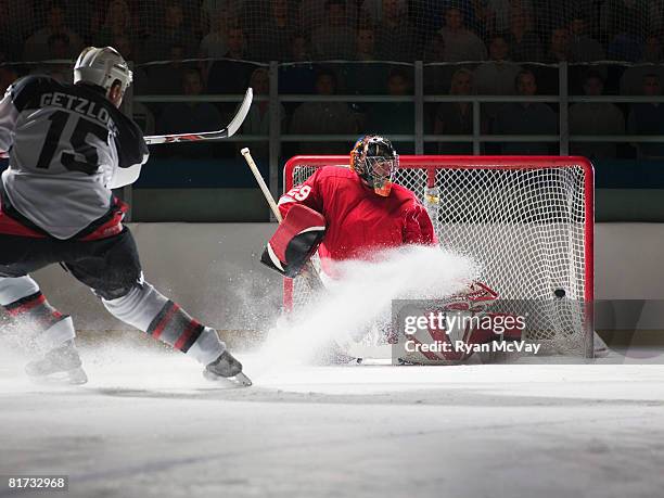 player scoring a goal in ice hockey - goal net stock pictures, royalty-free photos & images