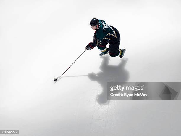 ice hockey player in possession of puck - hockey puck stock pictures, royalty-free photos & images