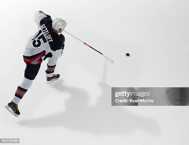 ice hockey player in possession of puck - hockey puck top view stock pictures, royalty-free photos & images